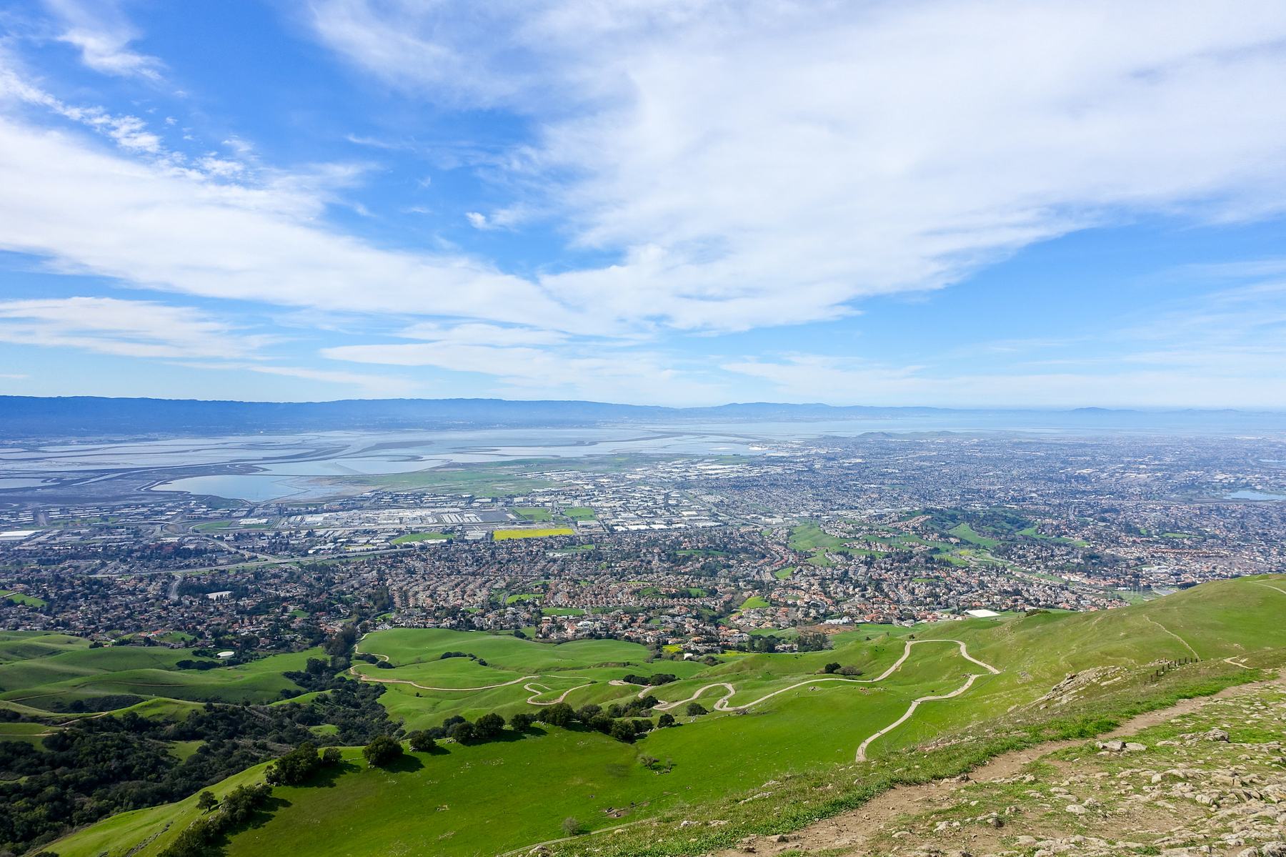 Fremont spread out below the East Bay hills, with the bay in the distance under a clear sky.