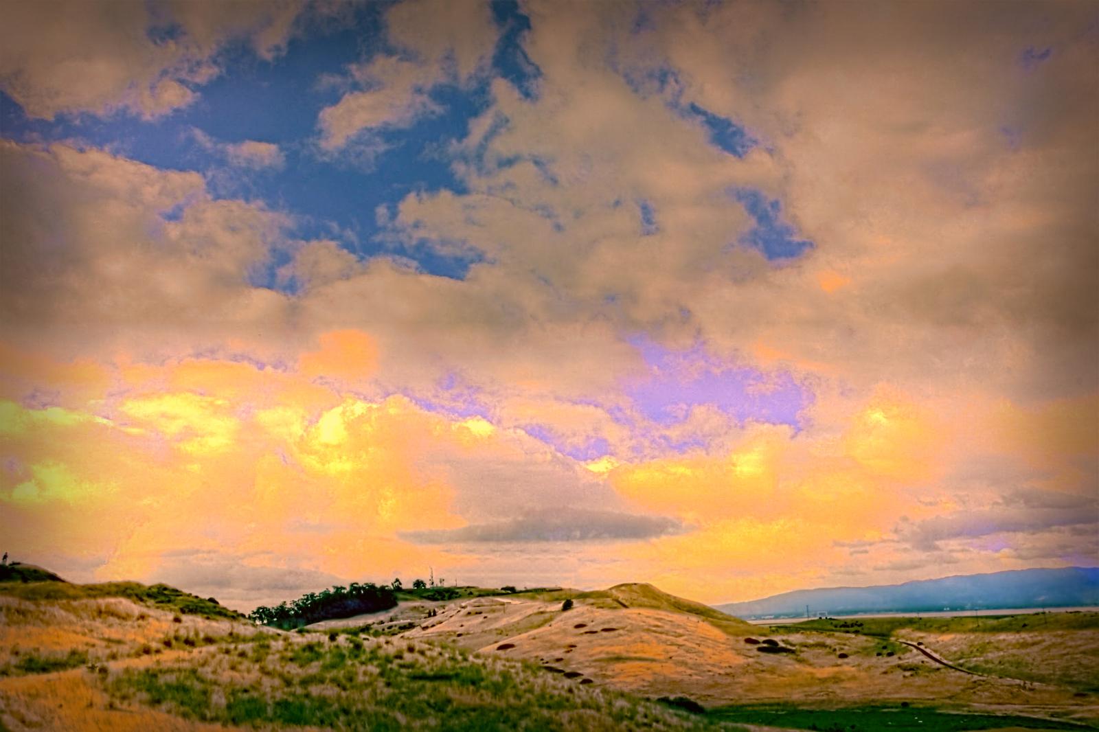 Golden East Bay hills under a wide sunset sky, the landscape typical of Fremont and the Mission Peak side of town.